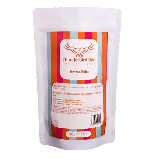 A 500g refill pouch of Thunderbird Skin Rescue Balm, featuring a colorful striped label with orange, pink, and blue stripes on a white background.
