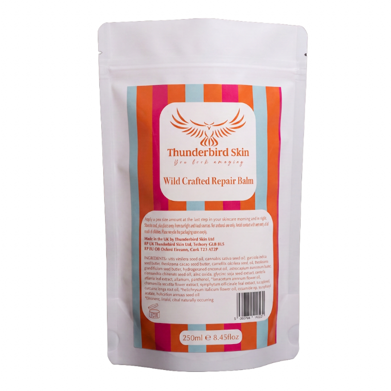 A 250ml stand-up pouch of Thunderbird Skin Wild Crafted Repair Balm, featuring a colorful striped label with orange, pink, and blue stripes on a white background.